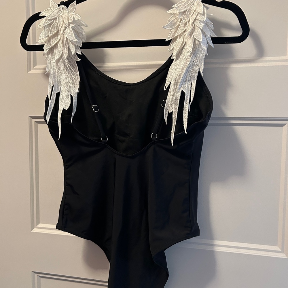 Black One Piece with White wings on back